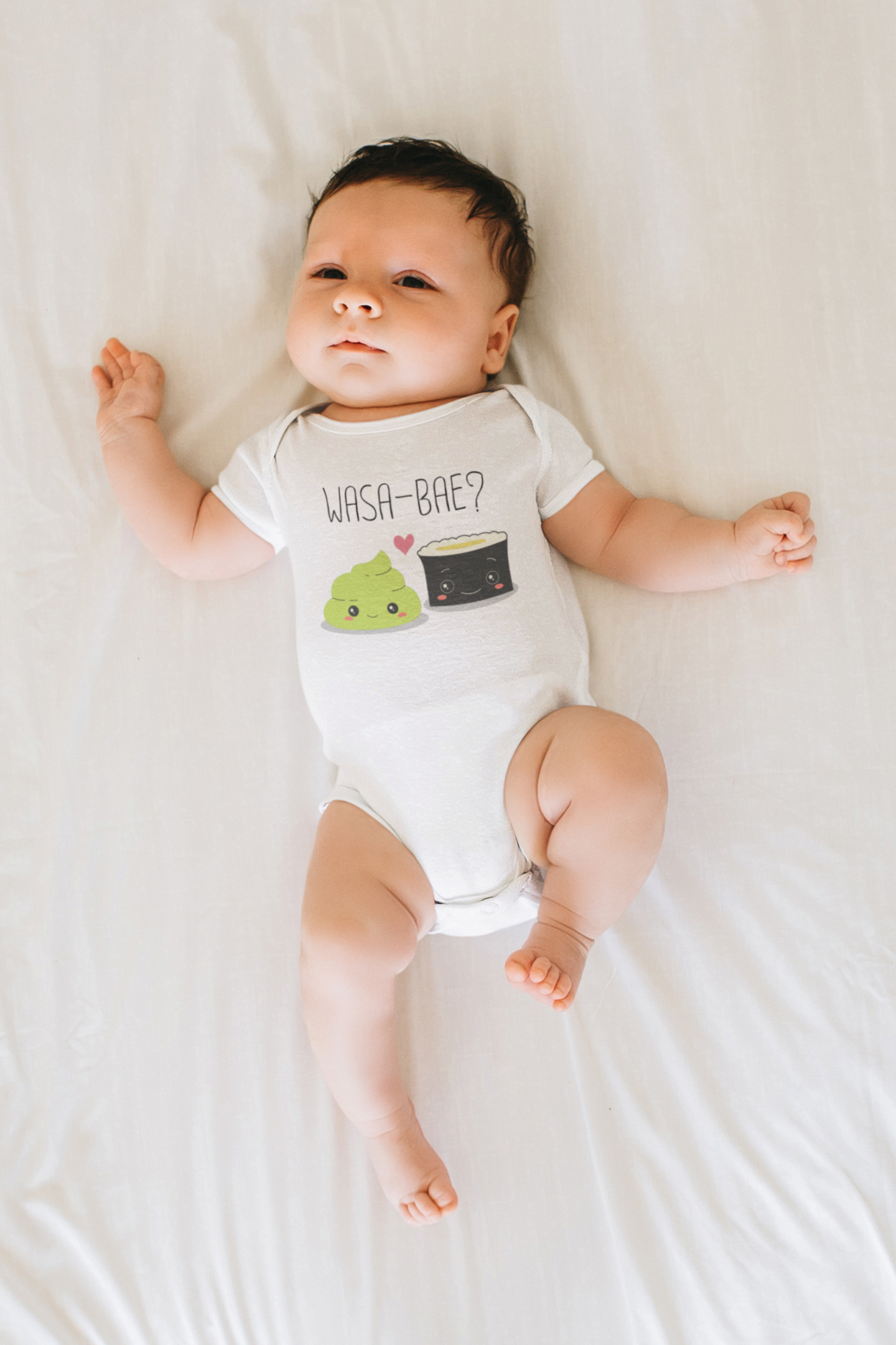 Baby bodysuit showcasing a cute printed graphic of a sushi and wasabi, along with the playful text 'Wasa-Bae.' Explore this delightful tee that adds a touch of trendy and fun style to your child's wardrobe.