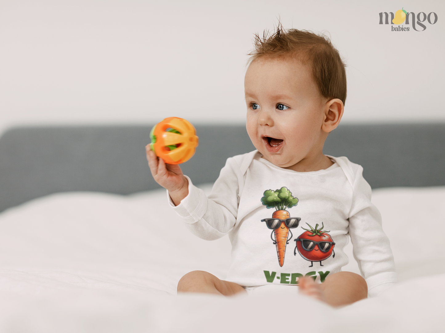 Cute tomato and carrot “V-Edgy” design on baby bodysuit, kids T-shirt, children’s sweater, and unisex adult shirt.