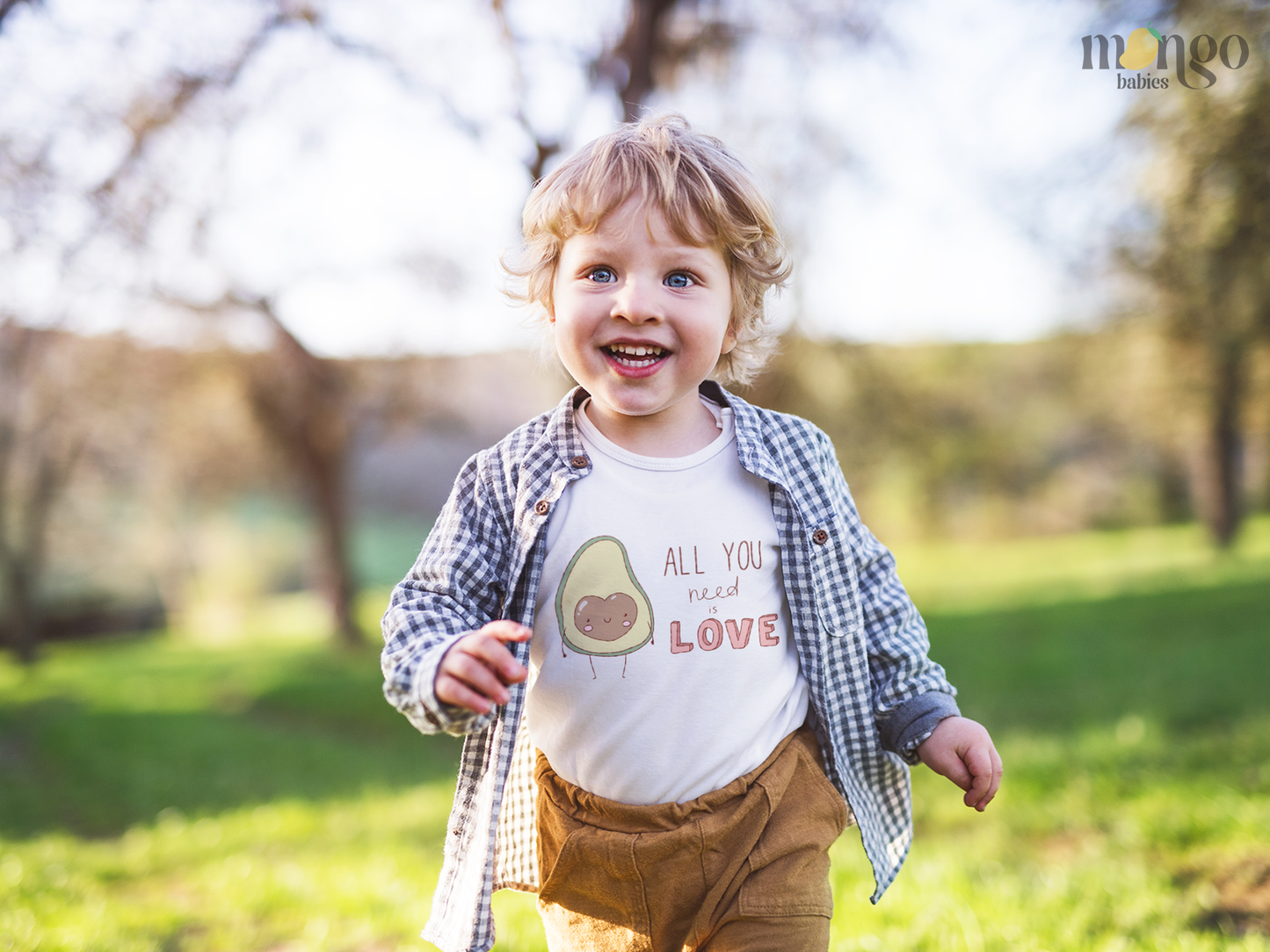 Cute avocado print with “All You Need is Love” text on baby bodysuit, kids’ T-shirt, children’s sweater, and unisex adult shirt.