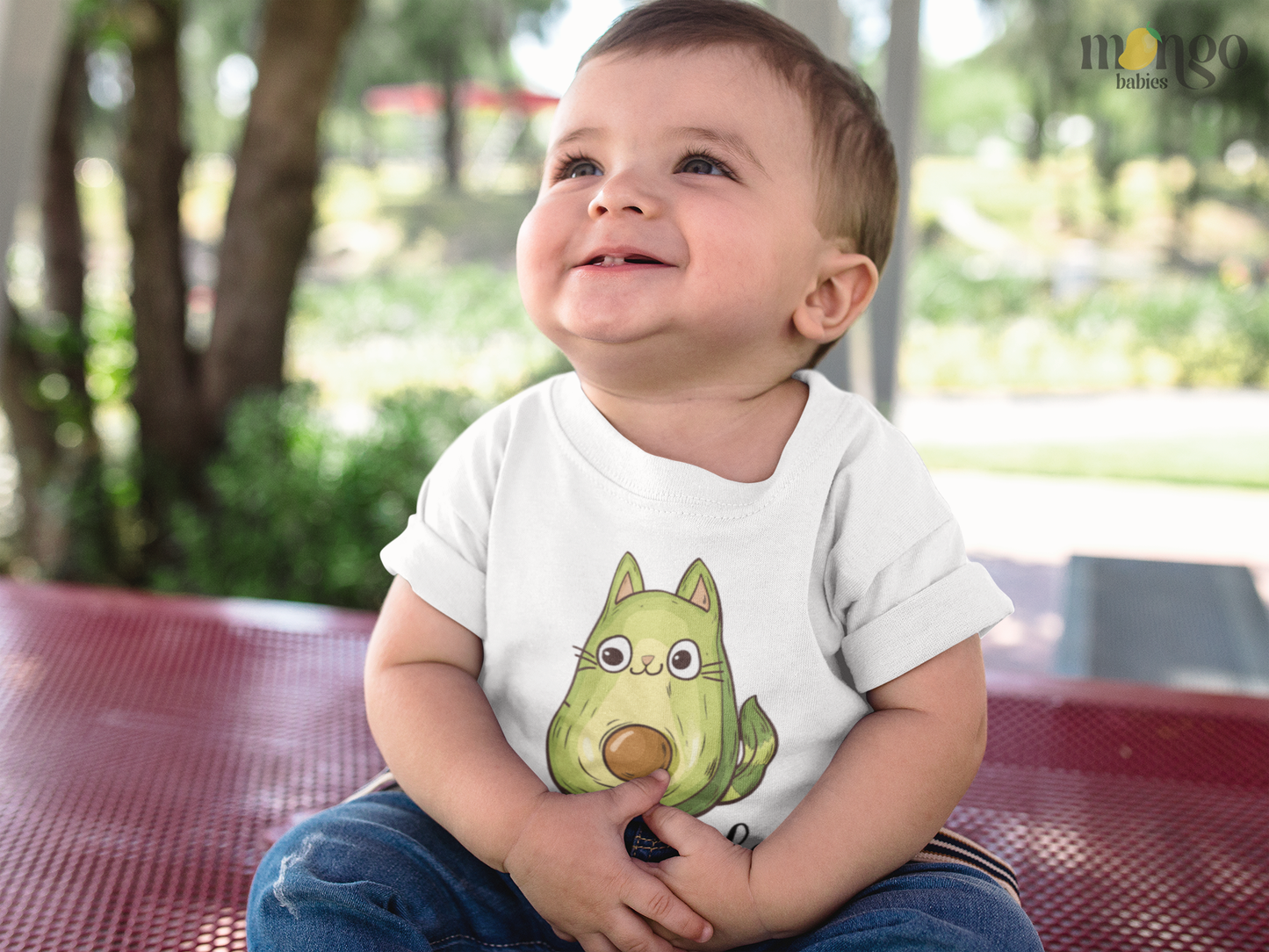 Cute “Avocatdo” cat-in-avocado design printed on baby bodysuit, kids’ T-shirt, children’s sweater, and unisex adult shirt.