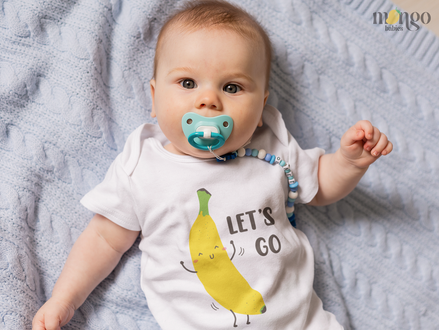 Fun and playful "Let's Go Banana" design on baby bodysuits, kids shirts, sweaters, and unisex adult tees. Soft, comfy, and perfect for matching family outfits!