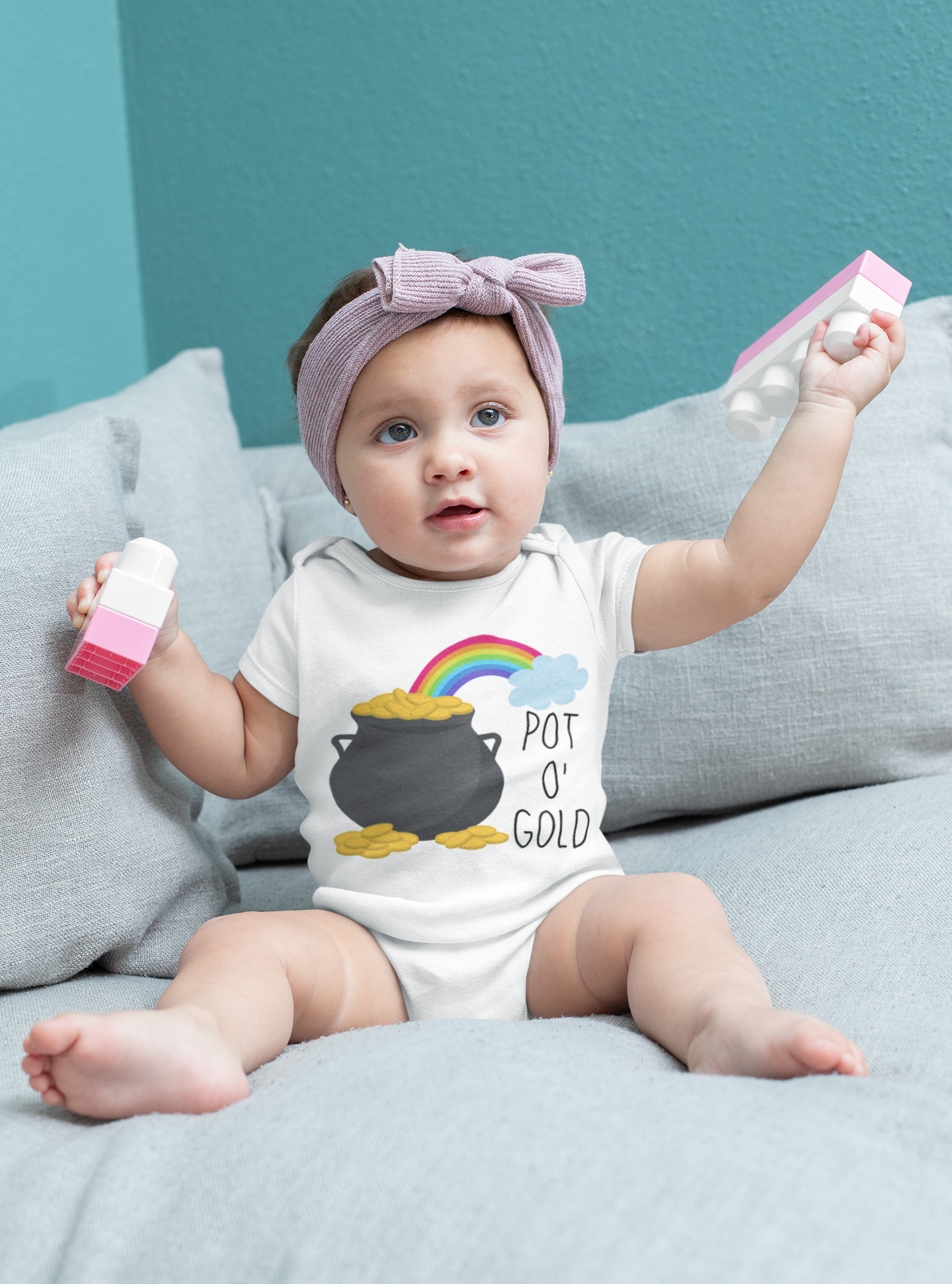 Baby and kids shirt with rainbow and pot of gold design featuring the text “Pot o’ Gold.” Available in onesies, toddler, and youth sizes.