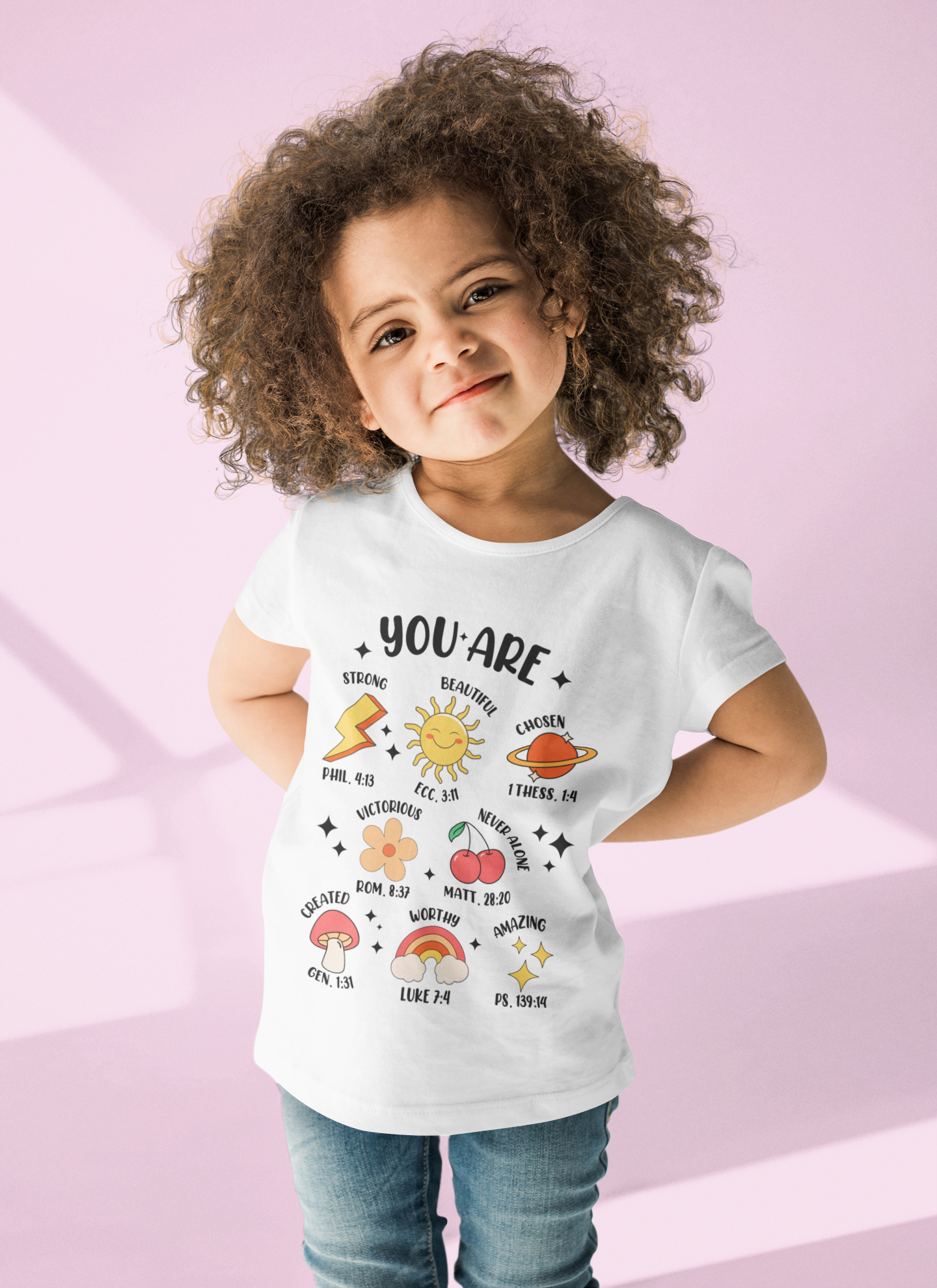 Baby and kids’ shirt with “You Are Strong Beautiful Chosen” text and cute icons of a sun, rainbow, flower, cherry, star, and planet.