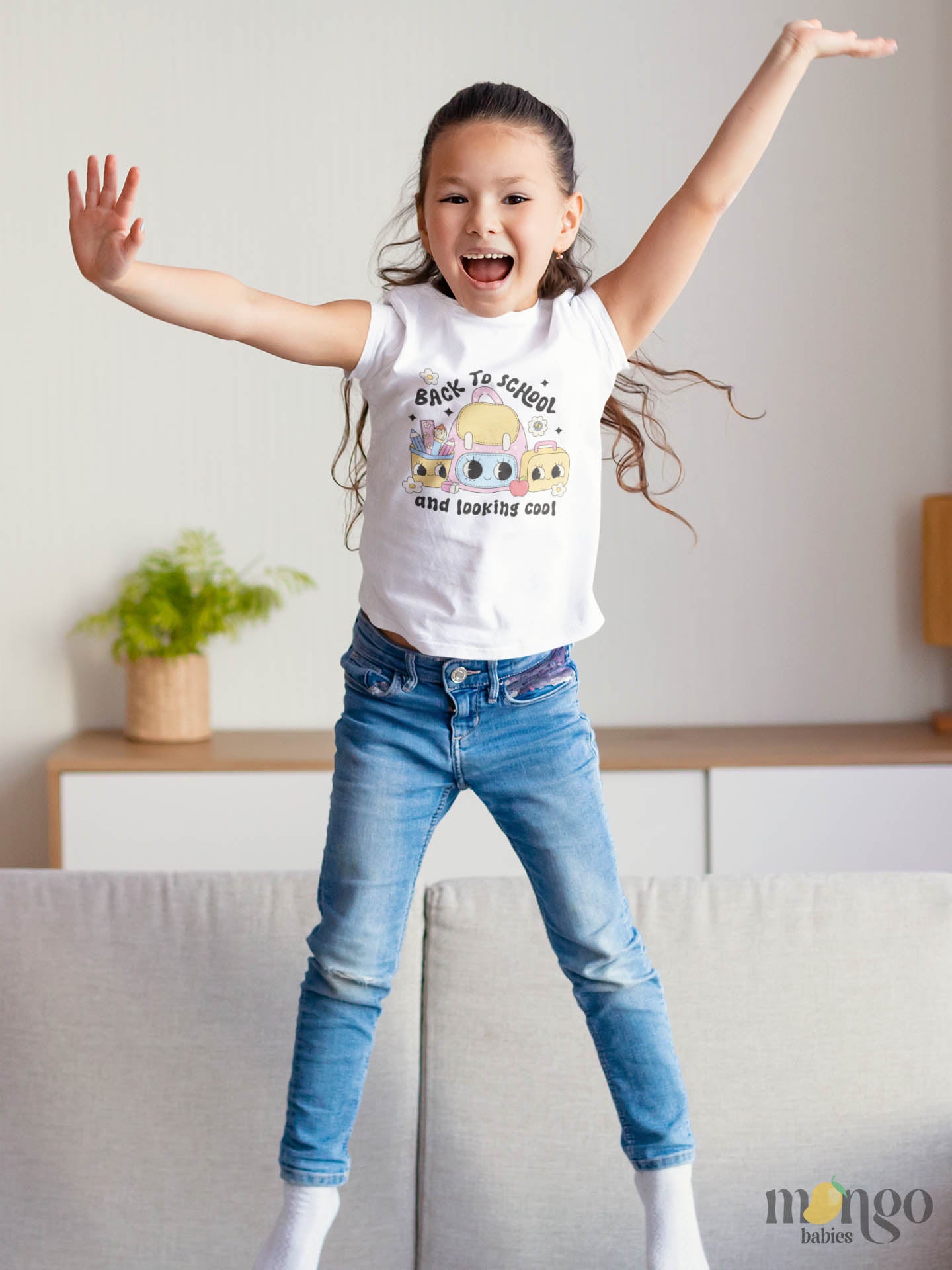 Cute “Back to School and Looking Cool” design with backpack, pencil, eraser, and lunchbox printed on toddler T-shirt, kids’ T-shirt, and children’s sweater.