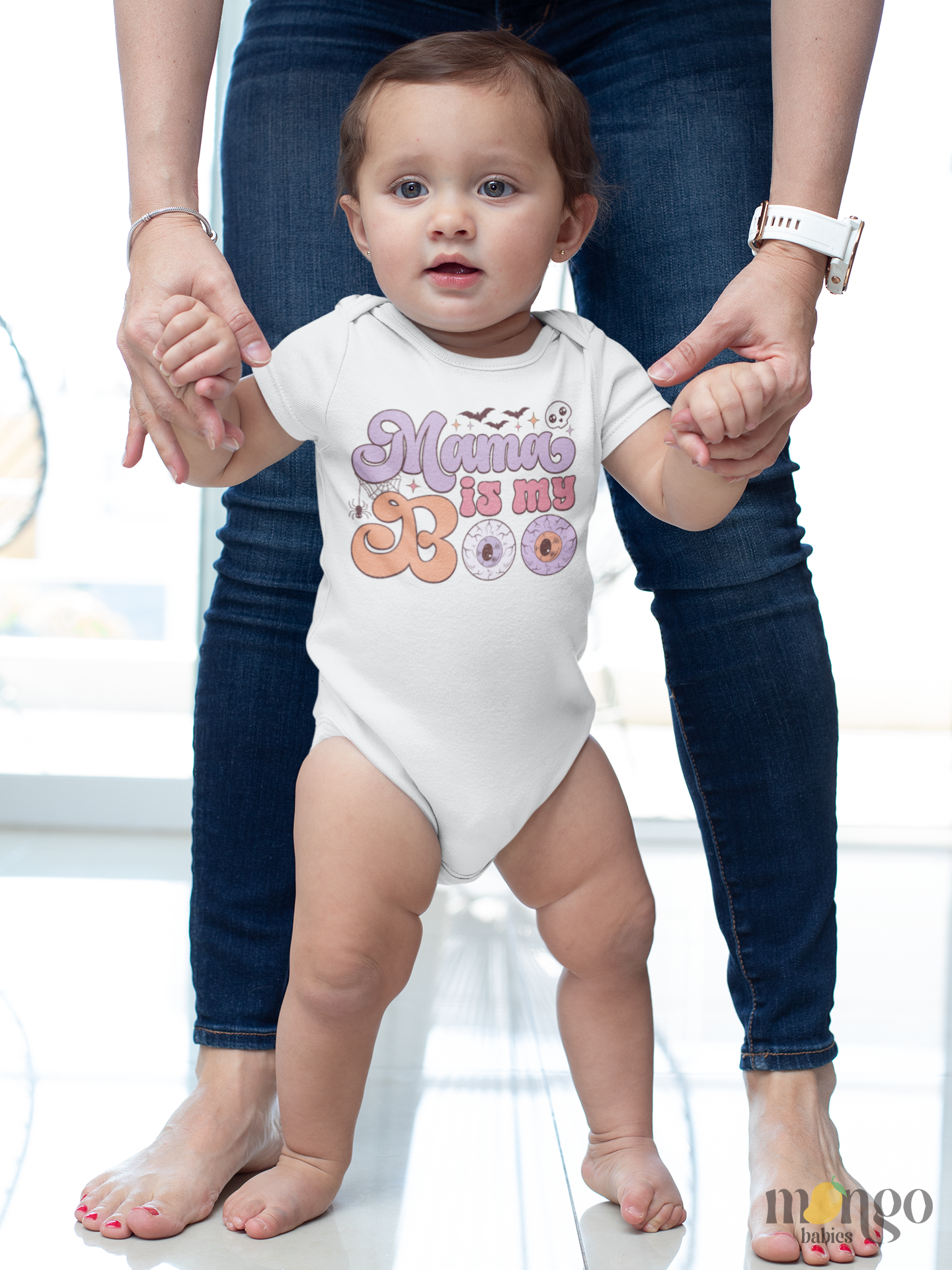 Pastel Halloween baby bodysuit with “Mama Is My Boo” text and cute seasonal graphics, available in newborn and kids’ sizes.