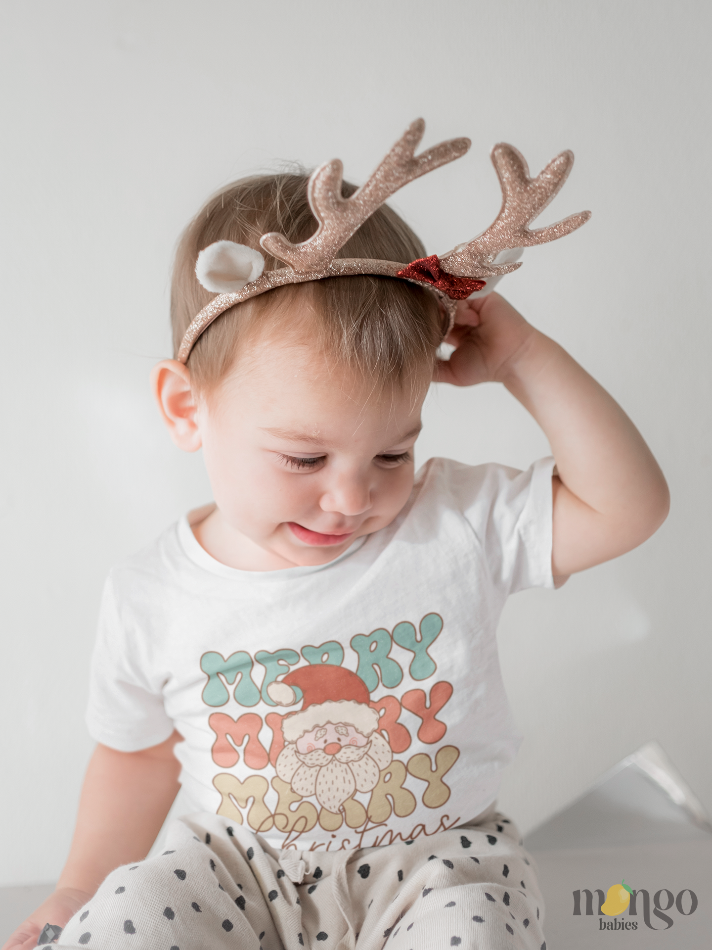 Retro Santa Claus Christmas shirt with “Merry Merry Merry Christmas” text, printed on baby onesie, toddler, and kids’ T-shirt in festive holiday style.