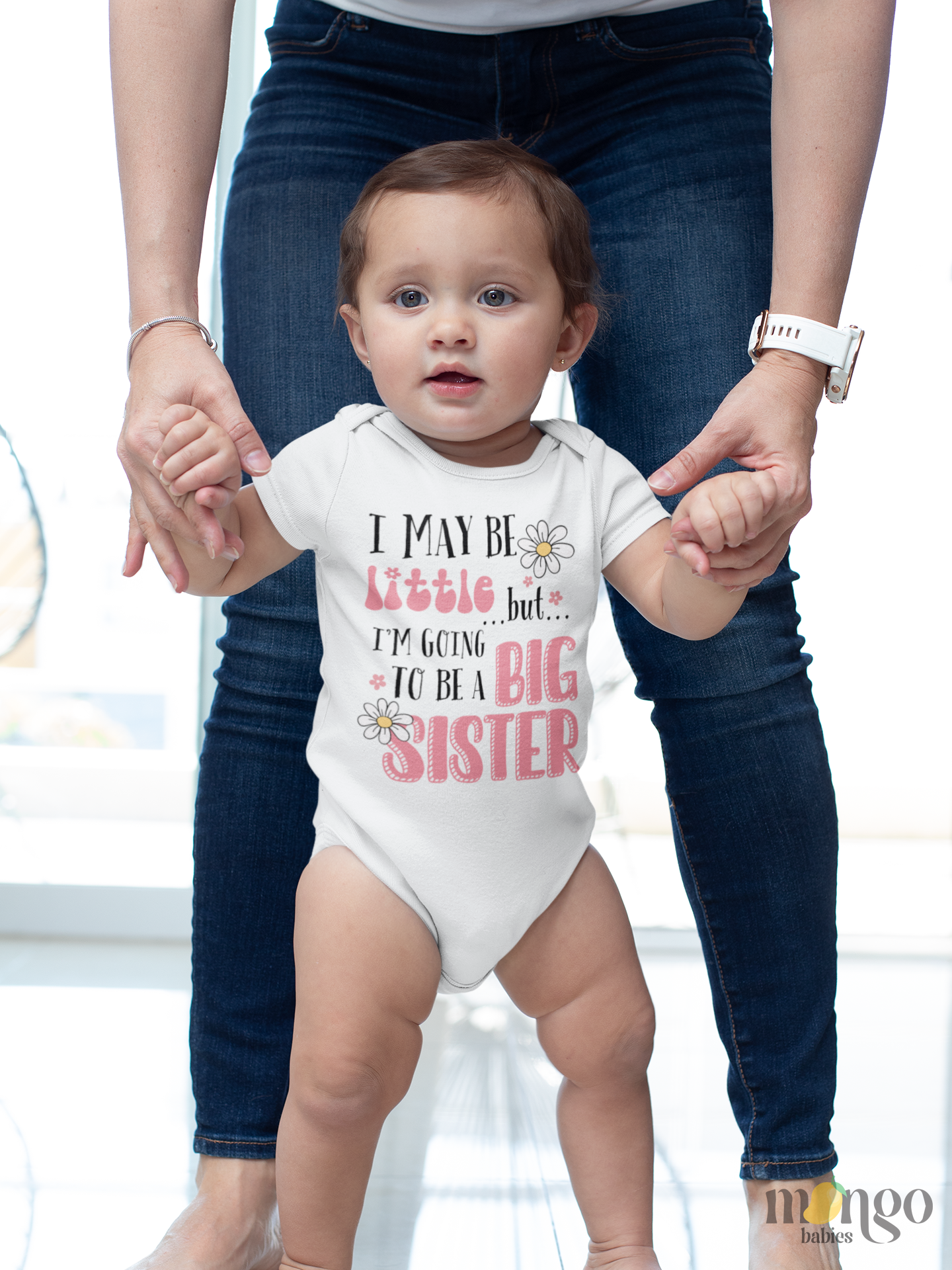 Cute baby onesie and kids’ T-shirt with the phrase “I may be little but I’m going to be a big sister.” Fun gift for pregnancy announcements or sibling reveals.