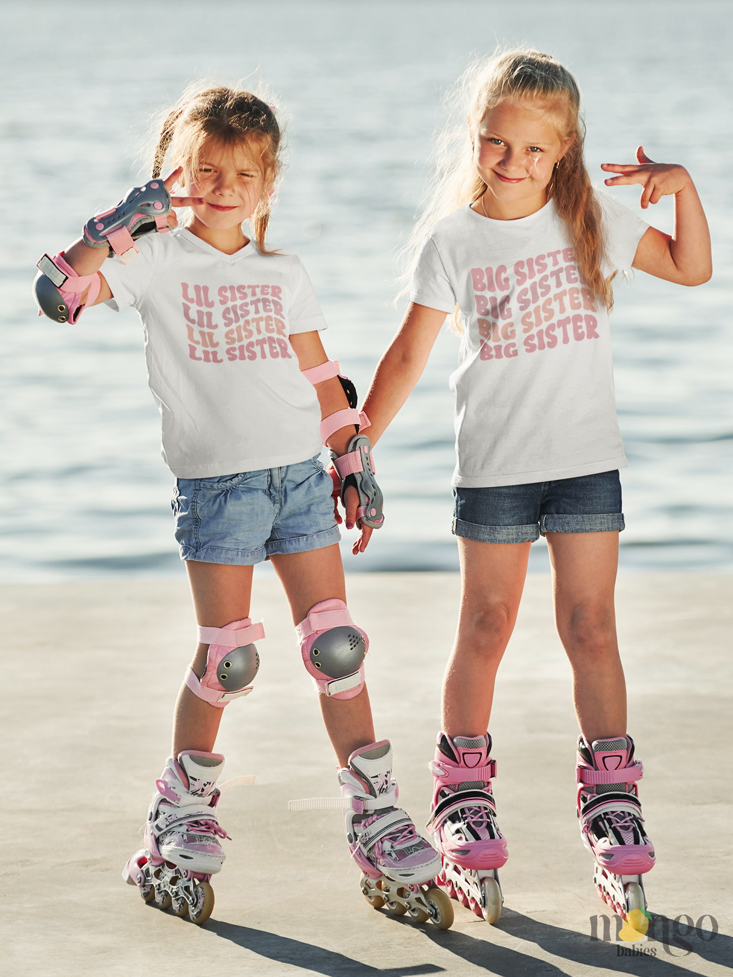 Pastel pink “Little Sister” text printed on baby onesie and kids’ t-shirts, available in multiple sizes. Cute sibling outfit and gift idea.