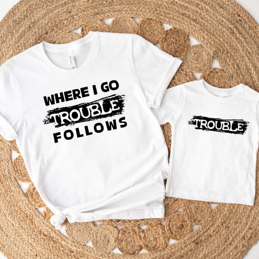 Bold “Where I Go, Trouble Follows” graphic print

Unisex style for boys, girls & grown-ups

Sizes for the whole family (baby to adult)

Great gift for mischievous little ones (or adults!)

Designed with love & printed on high-quality fabric

