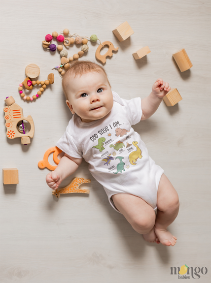 Cute “God Says I Am” dinosaur design on baby bodysuit, kids’ t-shirt, children’s sweater, and unisex adult shirt. Faith-inspired apparel for all ages.
