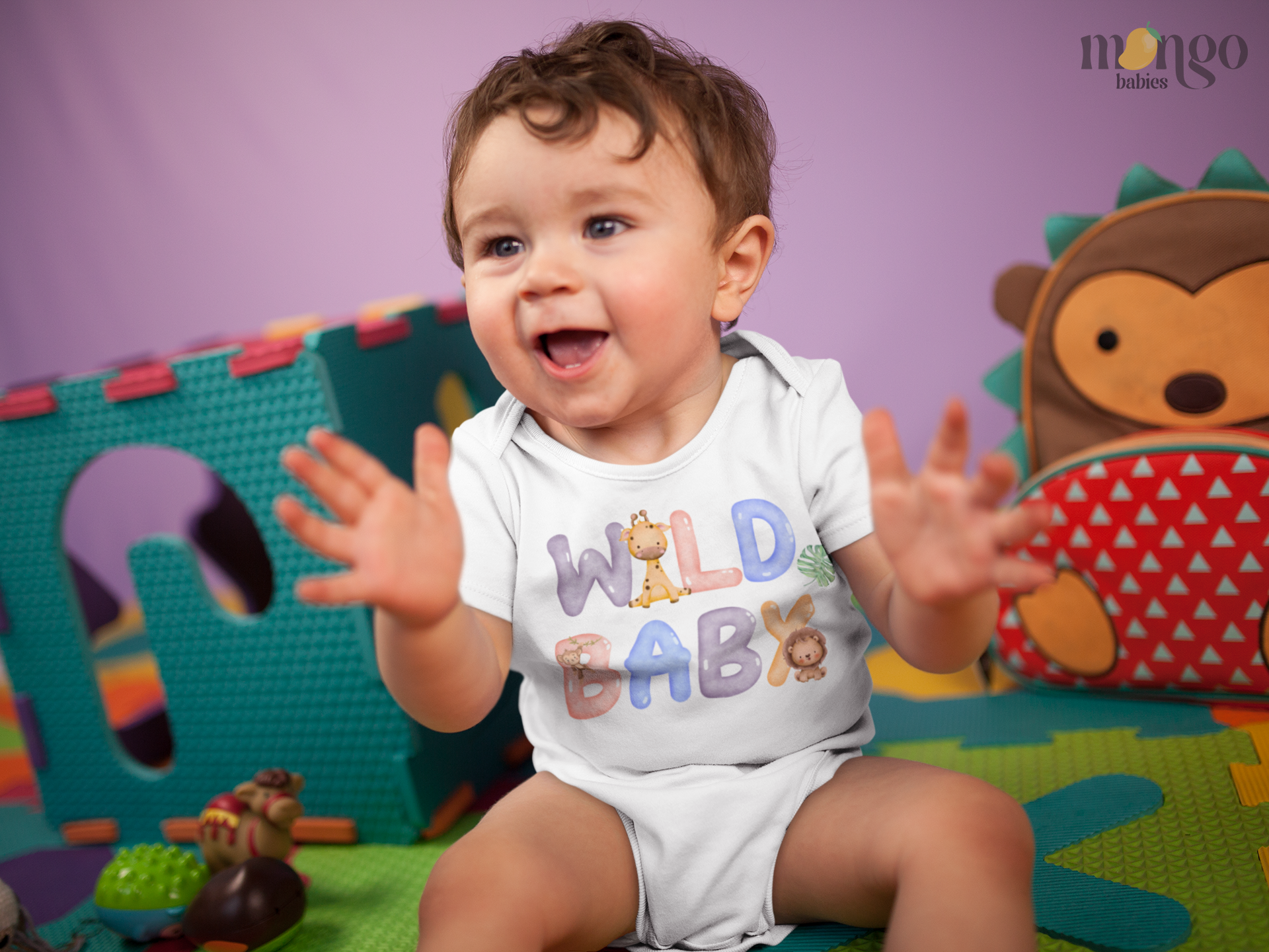 Cute lion, giraffe, and monkey “Wild Baby” design on baby bodysuit, kids’ t-shirt, toddler sweatshirt, and unisex adult shirt.