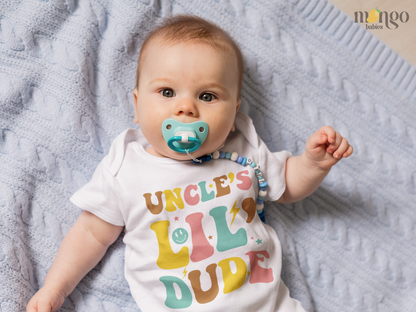 Retro "Uncle's lil dude" text design on baby bodysuit, kids t-shirt, sweatshirt, and unisex adult shirt.