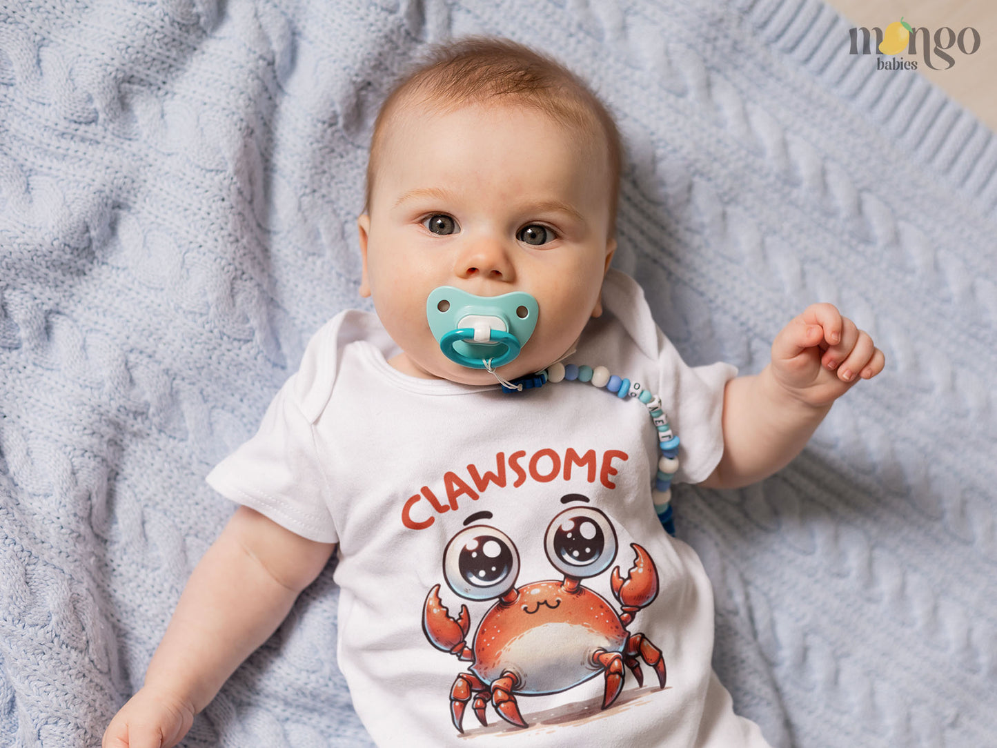 Cute red crab with the word “Clawsome” printed on baby bodysuit, kids T-shirt, sweater, and unisex adult shirt.
