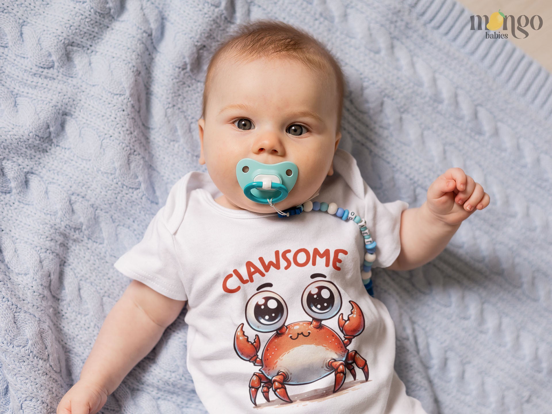 Cute red crab with the word “Clawsome” printed on baby bodysuit, kids T-shirt, sweater, and unisex adult shirt.
