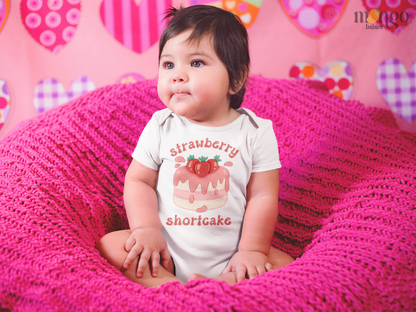 Cute strawberry shortcake graphic on baby onesie, kids’ t-shirt, sweatshirt, and unisex adult shirt.