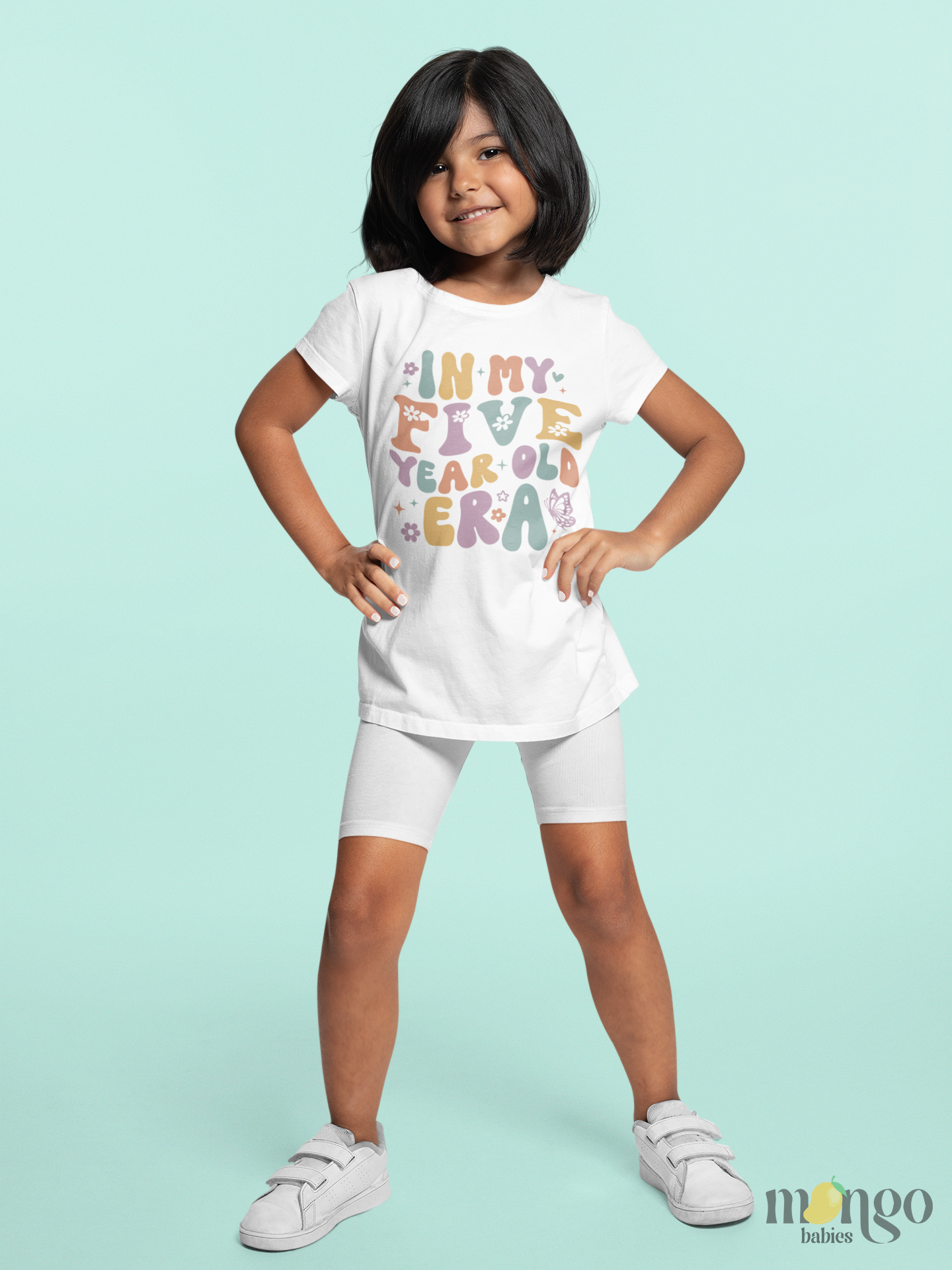 Retro pastel kids T-shirt with “In My Five Year Old Era” text, decorated with flowers and butterflies. Perfect birthday shirt for five-year-olds.
