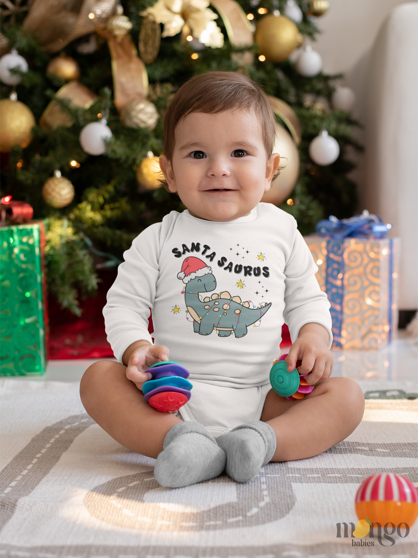 Cute Christmas dinosaur Santa Saurus design on baby bodysuit, kids t-shirt, children sweatshirt, and unisex adult shirt.