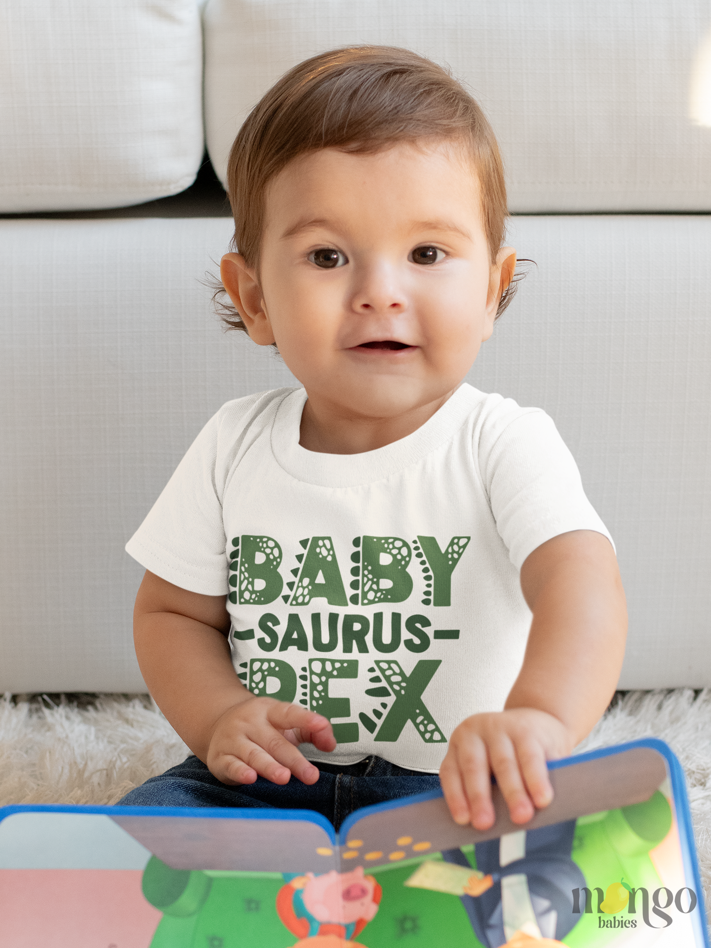 Cute dinosaur text design "Baby-Saurus-Rex" printed on baby bodysuit, kids t-shirt, sweatshirt, and unisex adult shirt.
