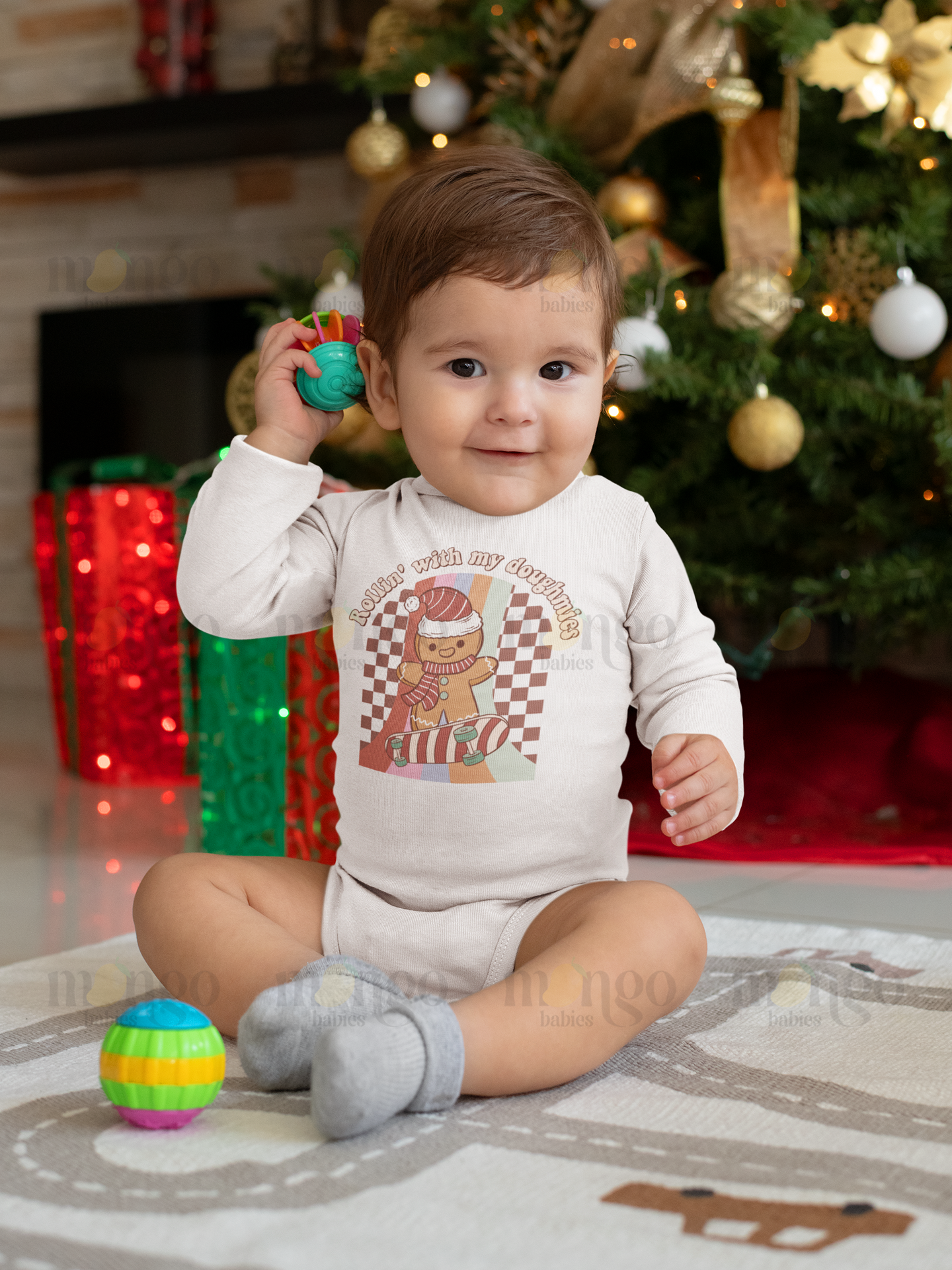Cute retro Christmas gingerbread design with text “Rollin’ with my Doughmies” on baby onesie, kids t-shirt, adult unisex shirt, and children’s sweatshirt.