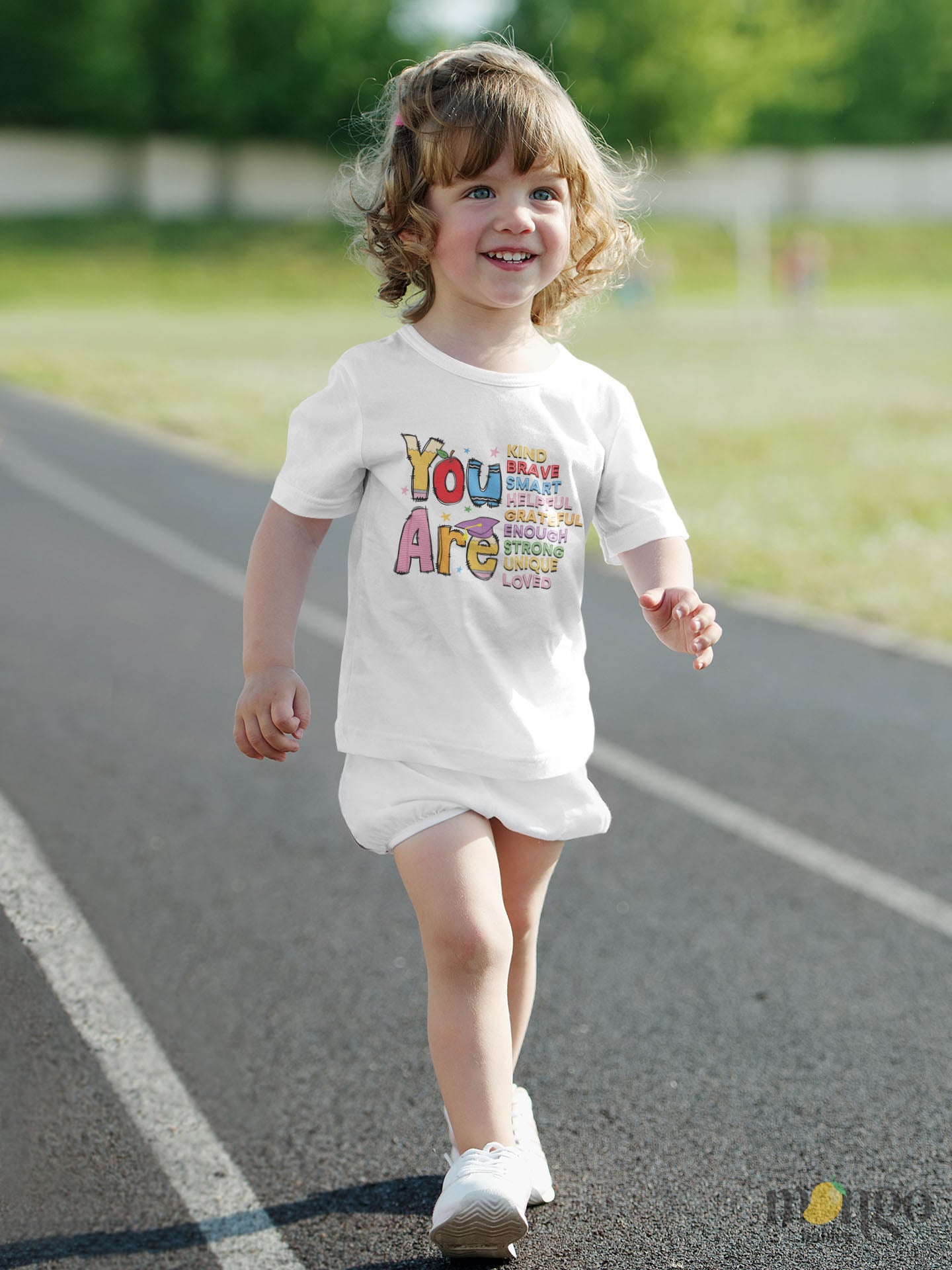 School-themed shirt with “You Are Kind, Brave, Smart” text, featuring colorful school items. Available in baby, kids, and adult sizes.
