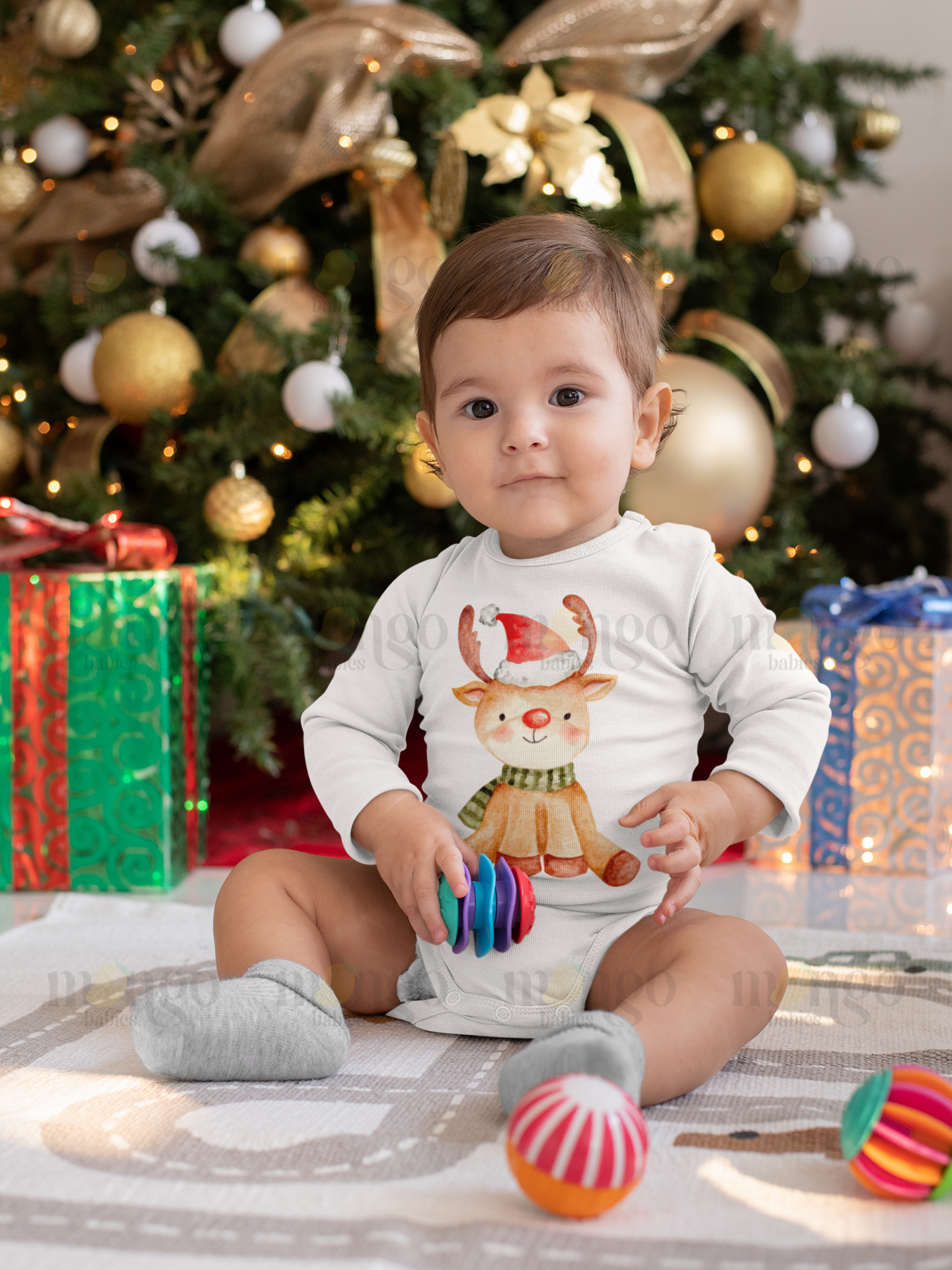 Cute watercolor reindeer Christmas design printed on baby bodysuit, kids’ t-shirt, sweatshirt, and unisex adult shirt.