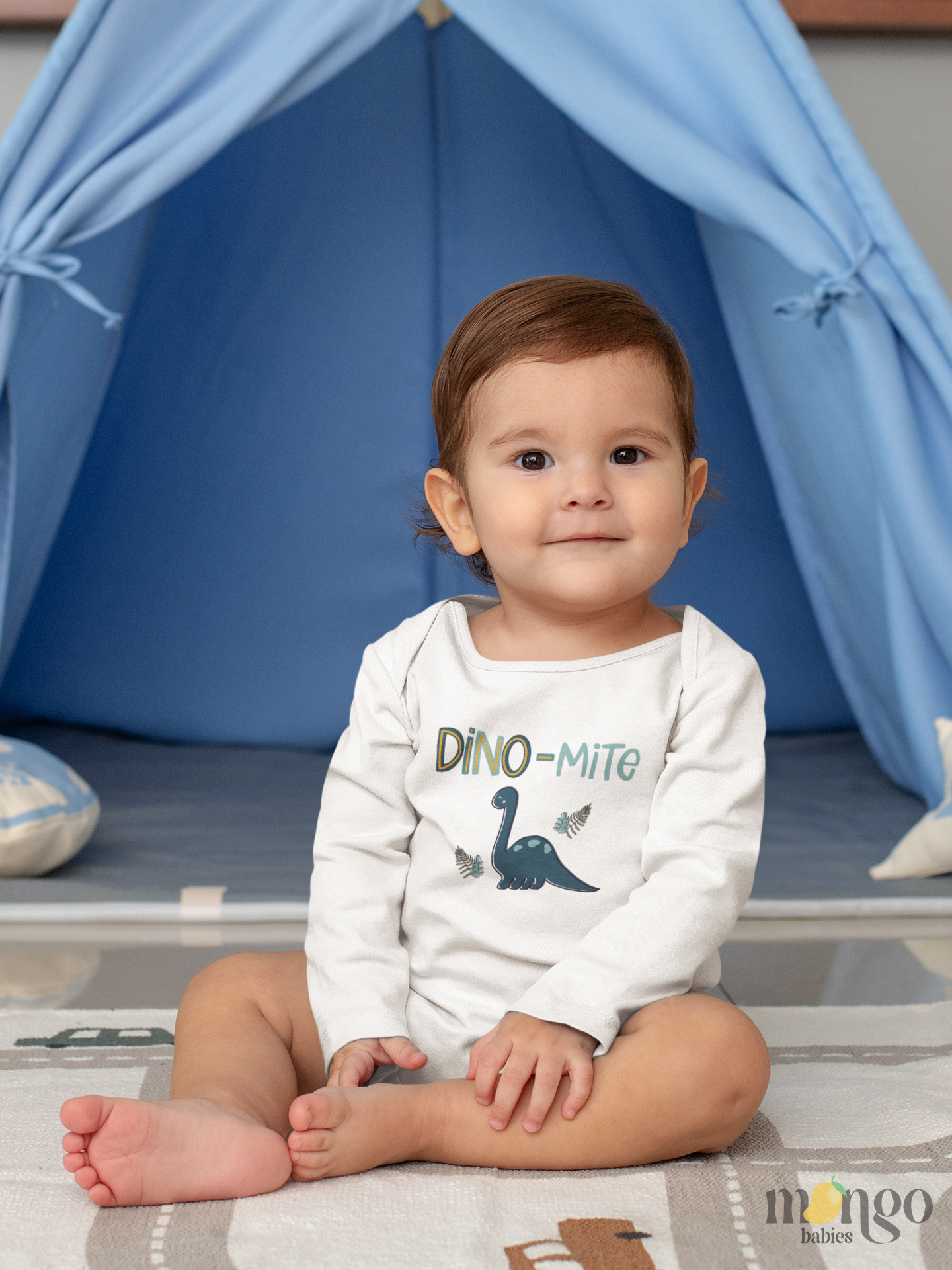 Cute dinosaur “Dino-mite” design on baby bodysuit, kids’ t-shirt, children’s sweatshirt, and unisex adult shirt.