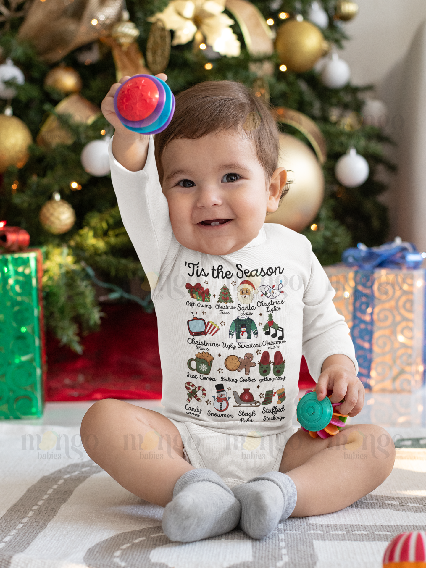 Cute Christmas shirt with festive icons including Santa, reindeer, snowman, tree, sleigh, and text "'tis the season" for babies, kids, and adults.