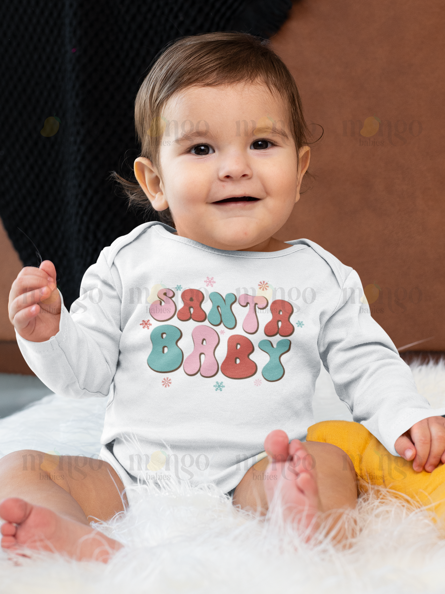 Pastel "Santa Baby" text printed on baby onesie, kids t-shirt, children’s sweatshirt, and unisex adult shirt – cute Christmas holiday outfit.