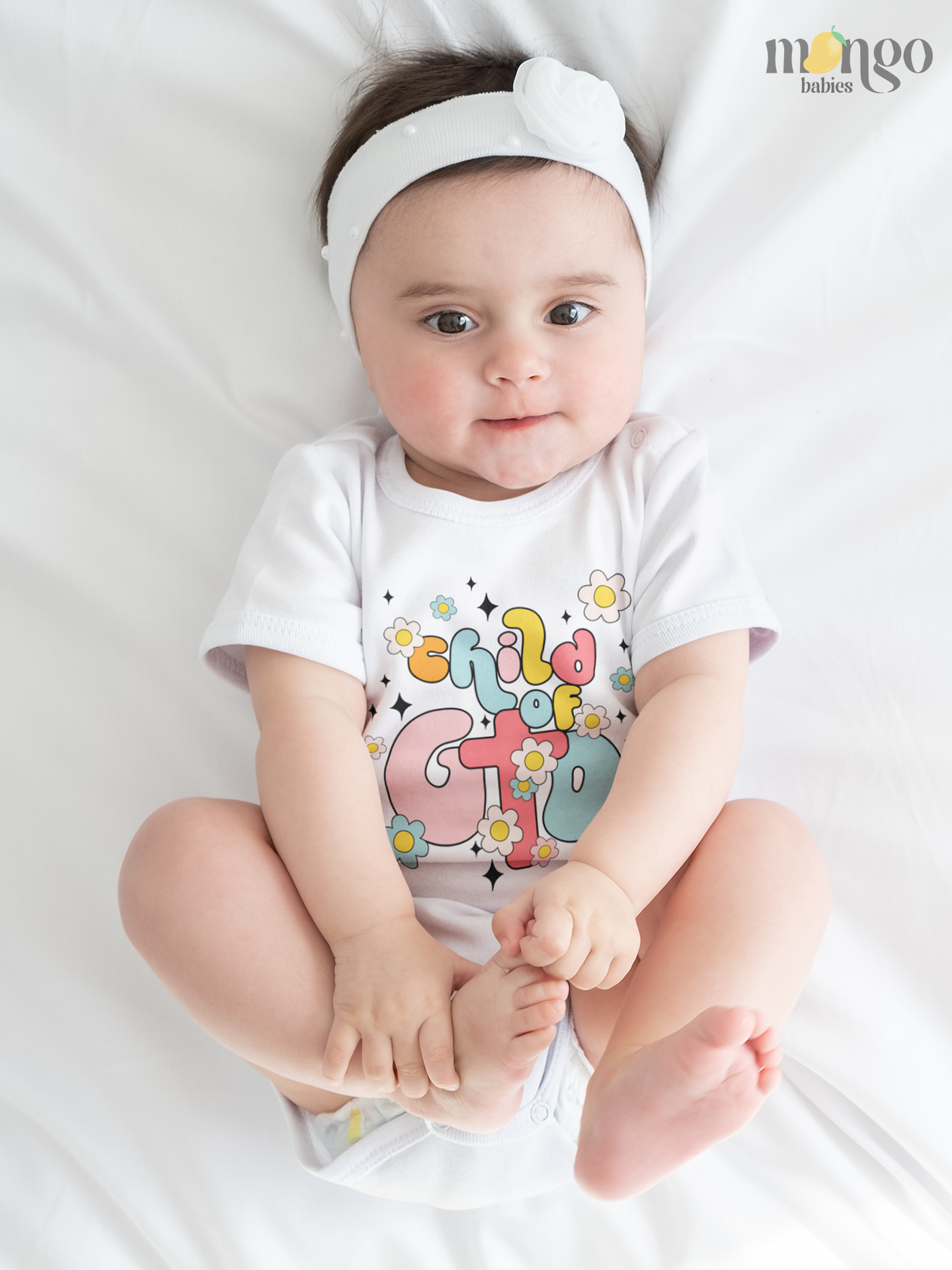 Retro flower “Child of God” design printed on baby onesie, toddler t-shirt, and kids’ shirt. Faith-inspired apparel in soft, comfortable cotton.
